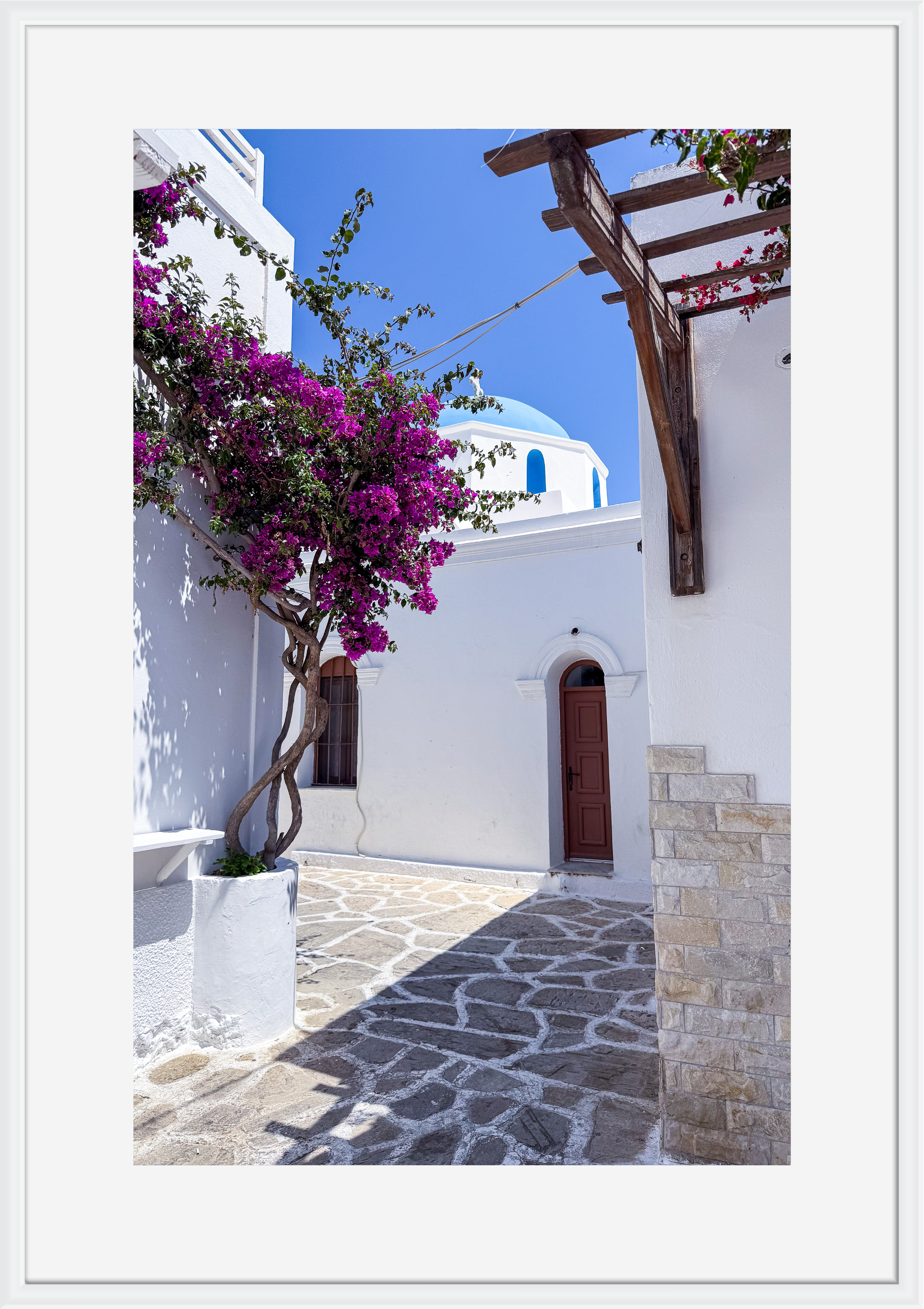 Pink bougainvillea against white walls in Naousa, Paros – photographic wall art print