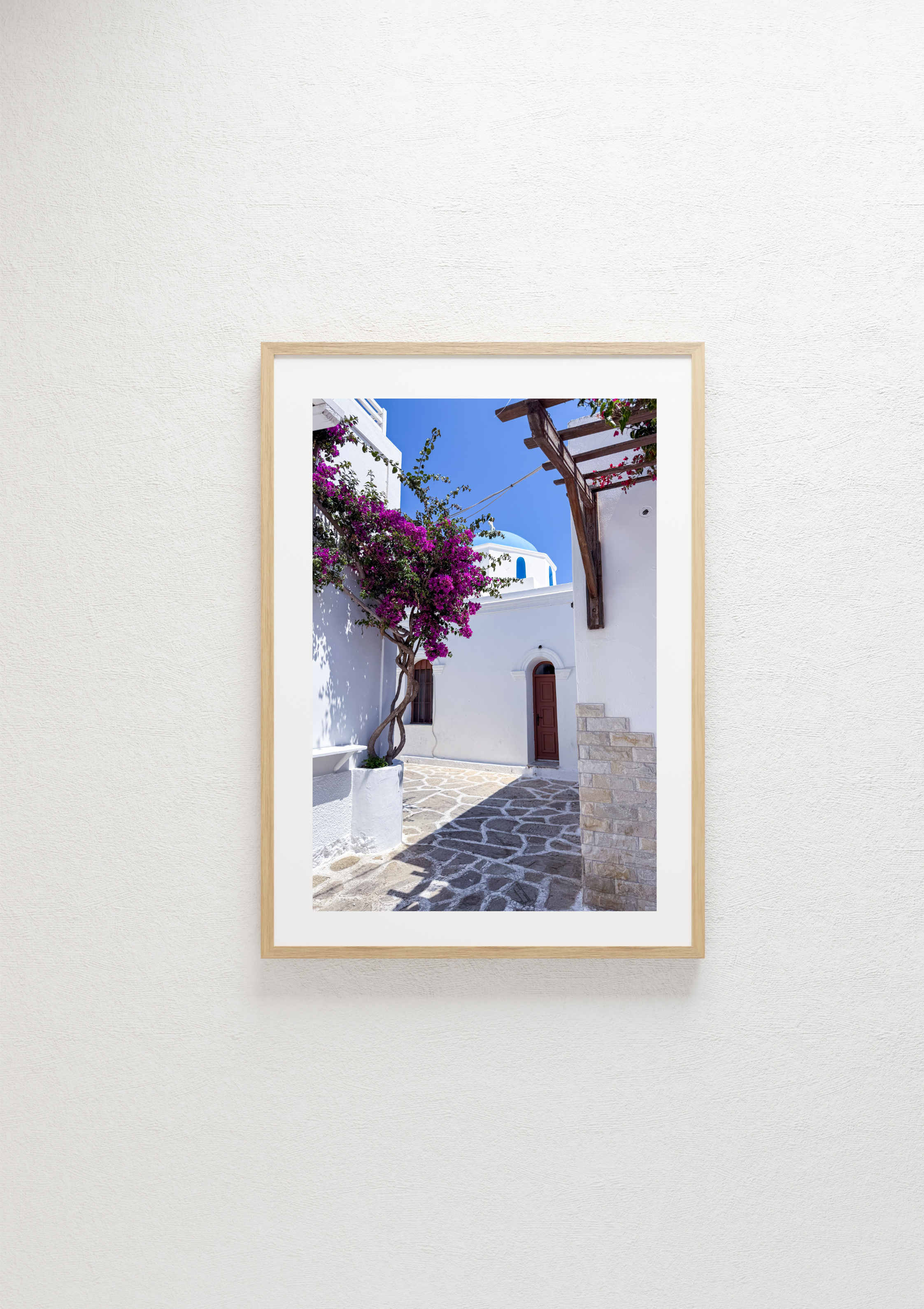 Pink bougainvillea against white walls in Naousa, Paros – photographic wall art print