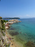 Swimmers in the clear waters of Corfu, Greece – photographic wall art print