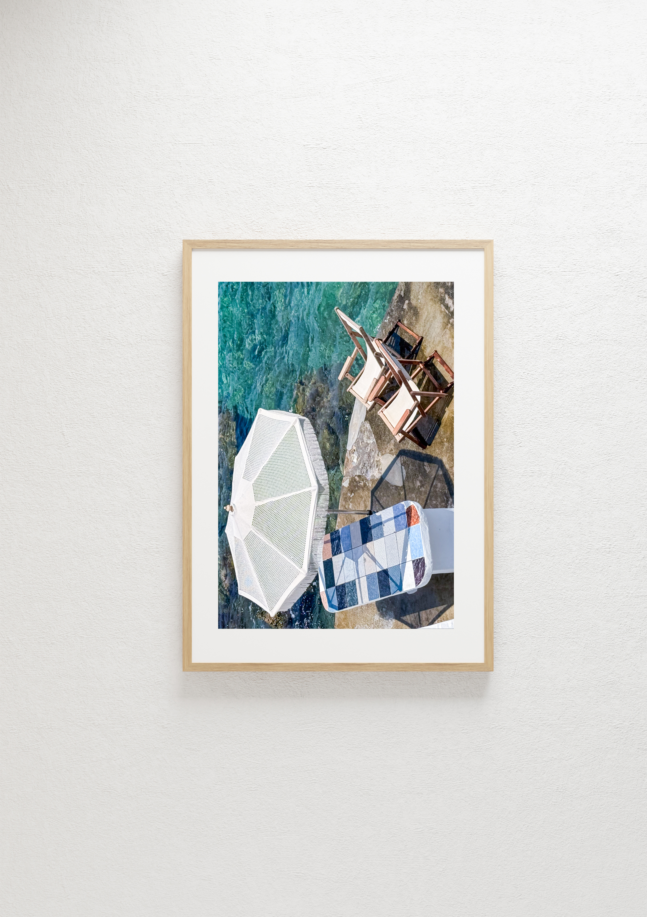 Taverna table at the water's edge in Mandrakia, Milos – photographic wall art print