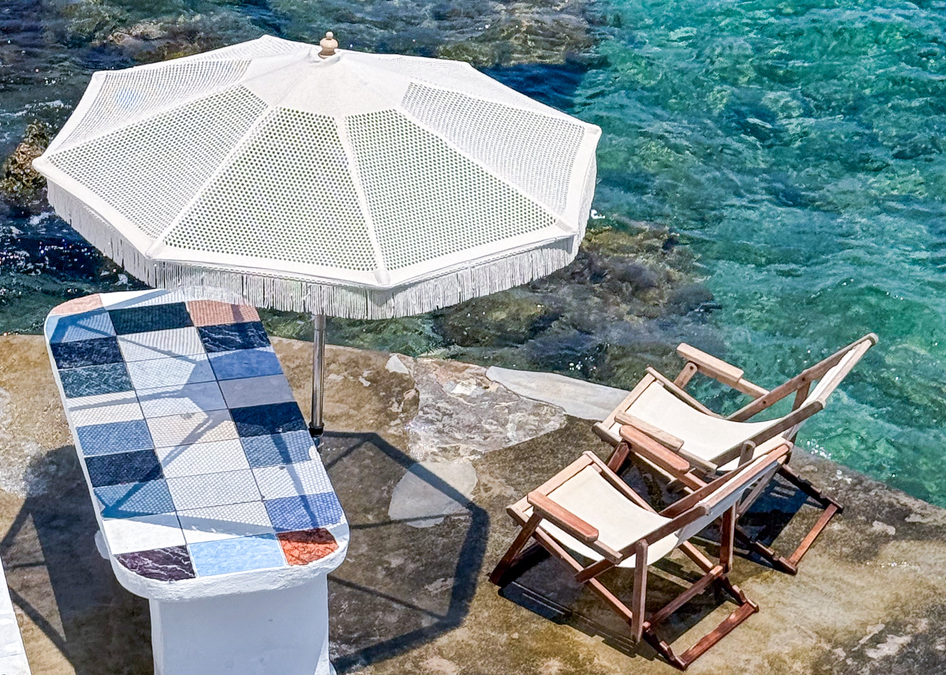 Waterside table in Mandrakia, Milos, Greece – photographic wall art print