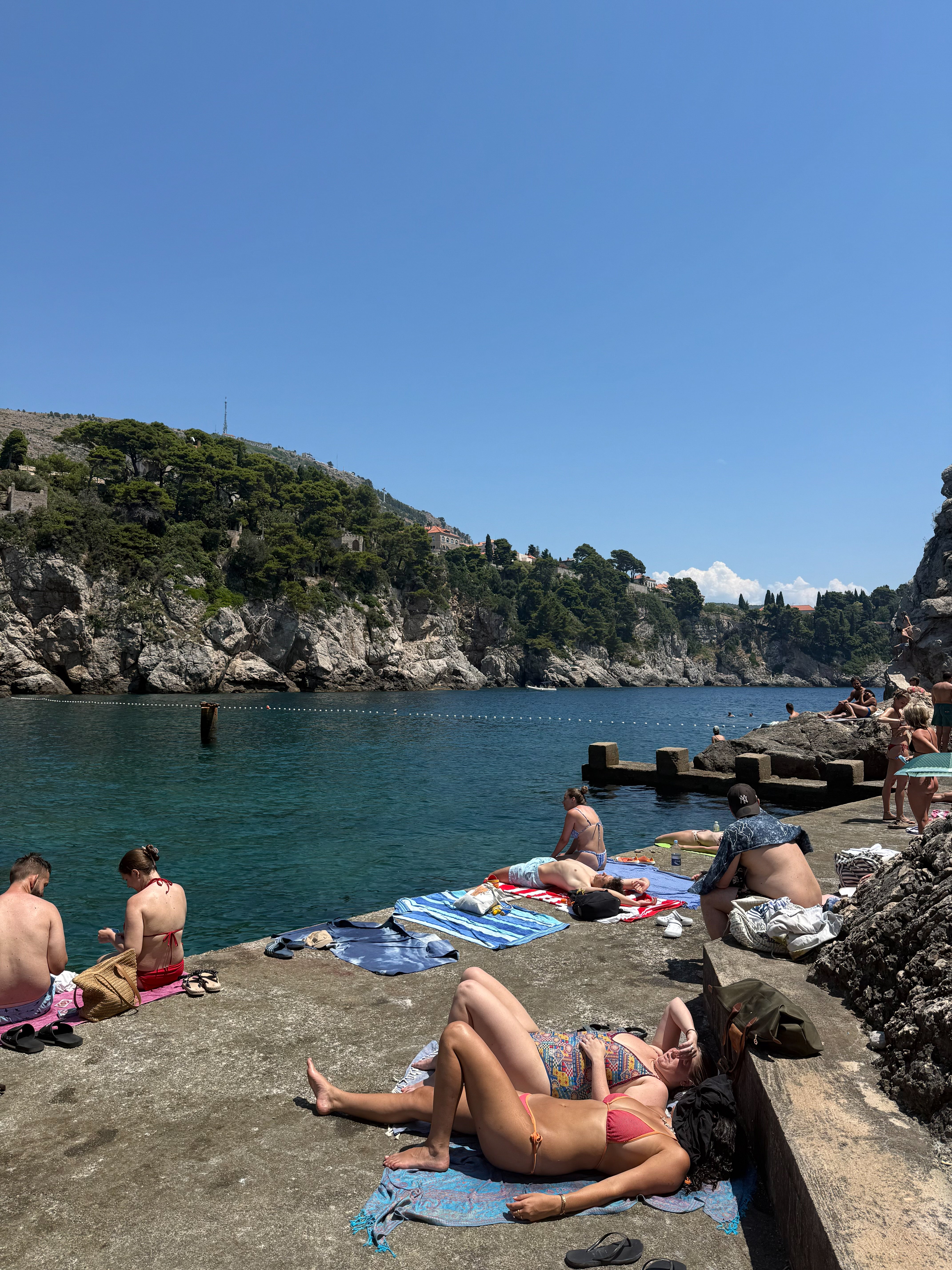 Swimmers below the old city walls of Dubrovnik – photographic wall art print