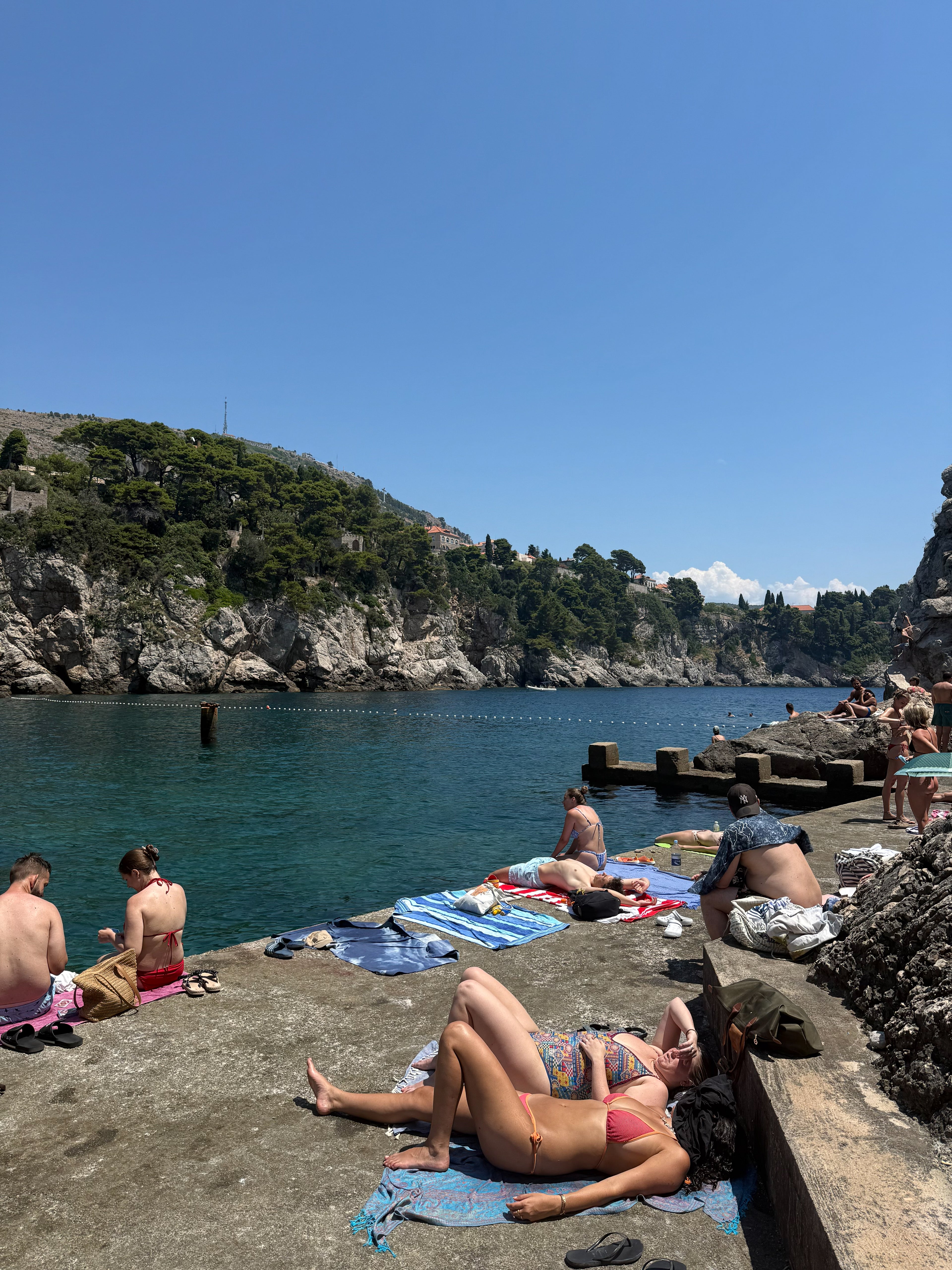 Swimmers below the old city walls of Dubrovnik – photographic wall art print